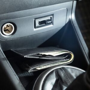 a wallet out in the open in a car